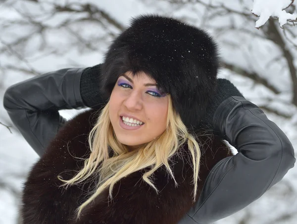 Young woman with black fur — Stock Photo, Image