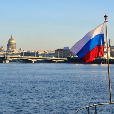 General view on Saint-Petersburg embankment and russian flag clipart