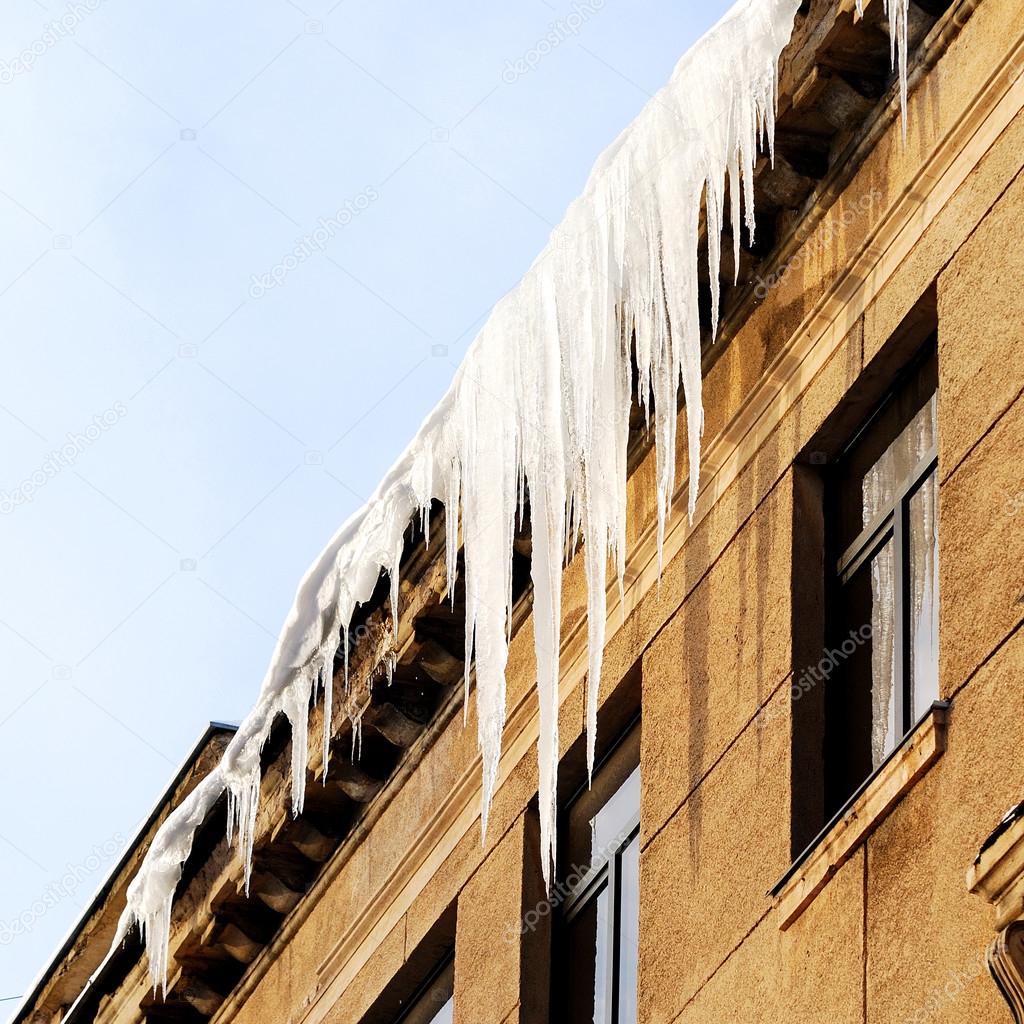 Icicles on the roof of the old house