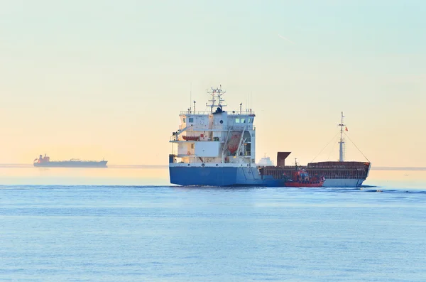 Cargo ship sailing away — Stock Photo, Image