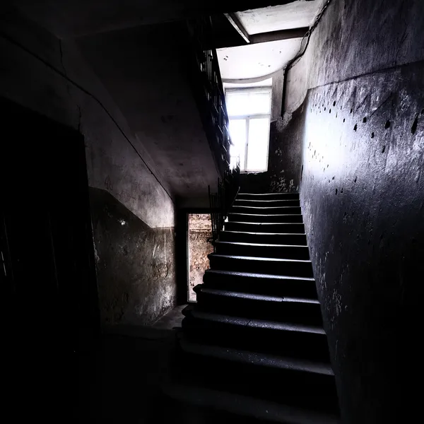 Old staircase in dramatic light — Stock Photo, Image