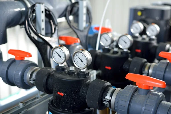 Industrial barometers and water pipes in boiler room — Stock Photo, Image