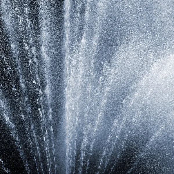 Fragment of fountain water drops in the air — Stock Photo, Image