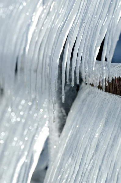 Group of icicles on the pier in winter — Stock Photo, Image