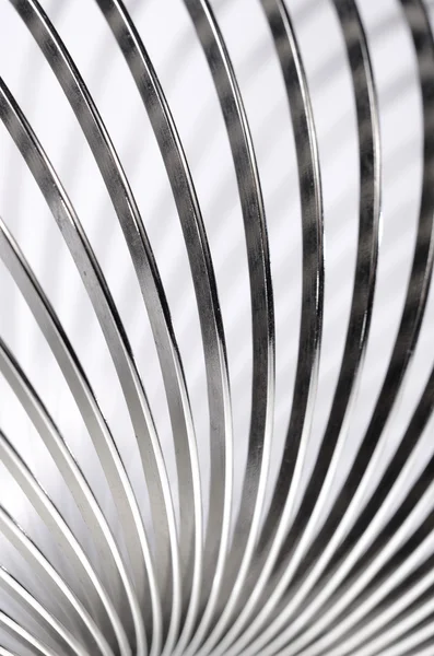 Metal slinky toy close-up — Stock Photo, Image