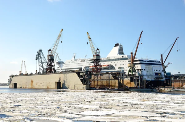 White passenger ferry is being fixed at the shipyard dock in the — Stock Photo, Image