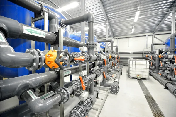 New plastic pipes and colorful equipment in industrial boiler room — Stock Photo, Image
