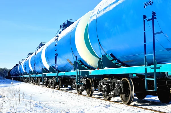 Blue cargo train on the move in winter — Stock Photo, Image