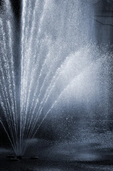 Fragment of fountain water drops in the air — Stock Photo, Image