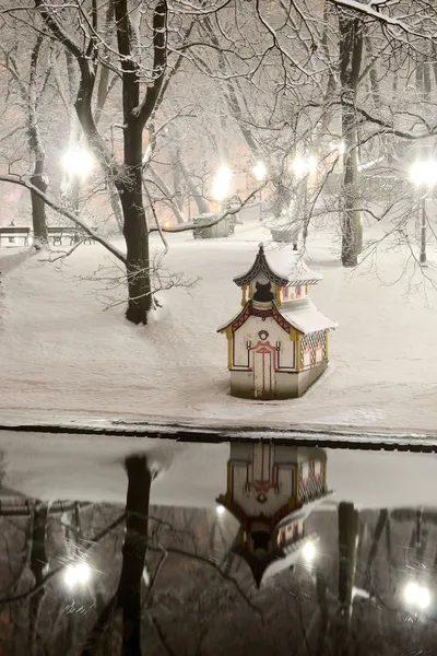 Snow on trees in Riga park and chinese house — Stock Photo, Image