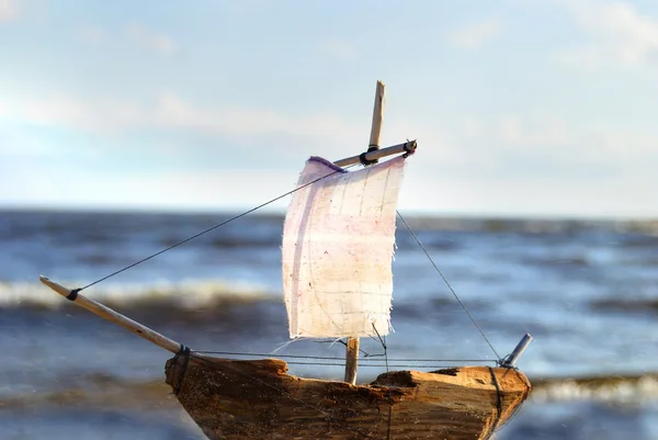 Wooden sail ship toy model in the sea — Stock Photo, Image