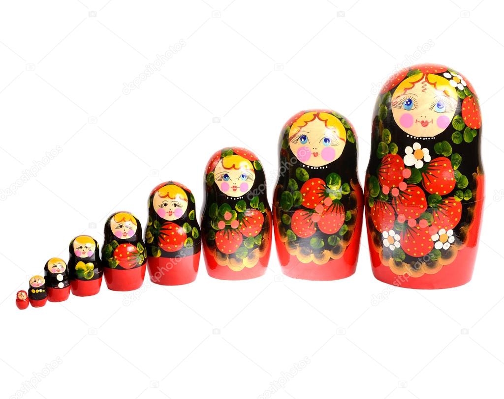 Russian traditional toy dolls matryoshka standing in row isolate