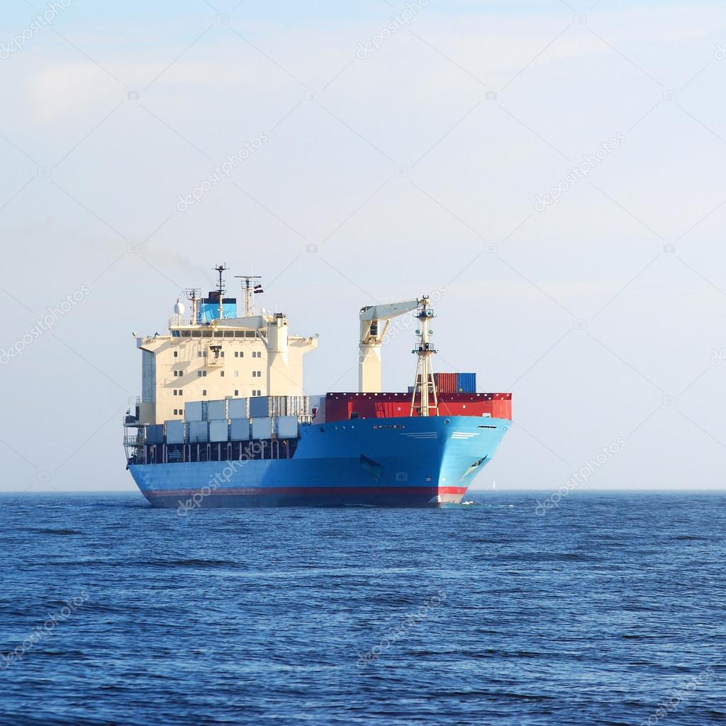 cargo conteiner ship sailing in still water