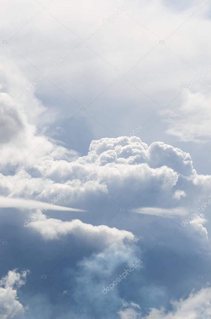 Classic cloudscape. Blue sky with ornamental clouds