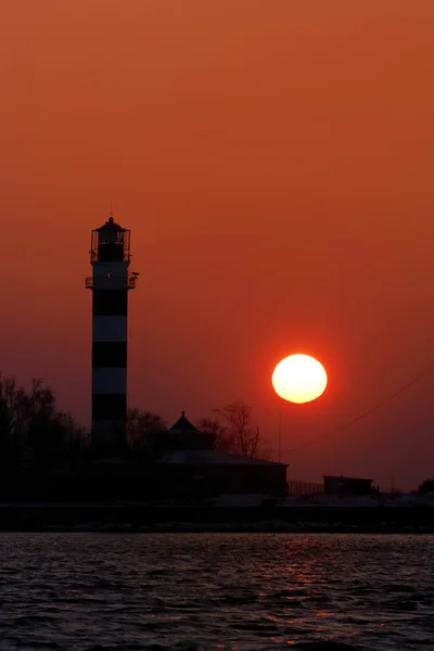 Lighthouse silhouette at the sunset — Stock Photo, Image