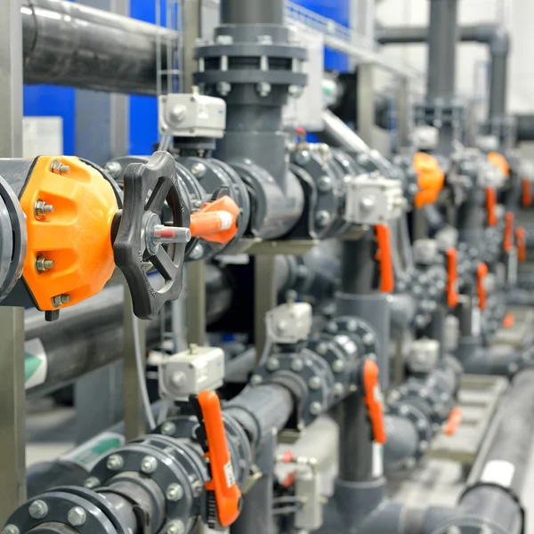 New plastic pipes and colorful equipment in industrial boiler room — Stock Photo, Image