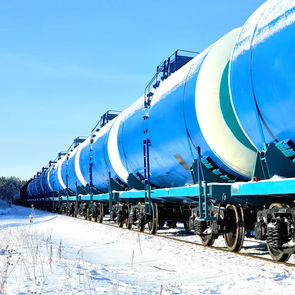 Blue cargo train on the move in winter — Stock Photo, Image