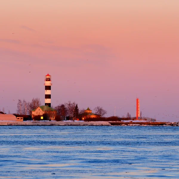 Lighthouse in port of Riga at the sunrise — Stock Photo, Image