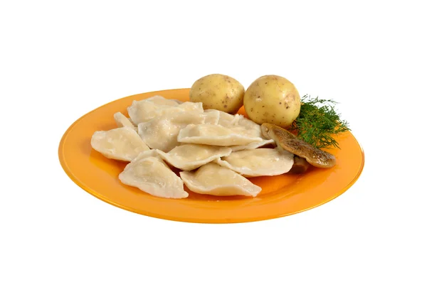 Potato and mushrooms dumplings on the dish — Stock Photo, Image