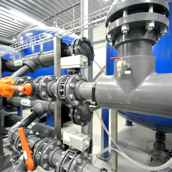 New plastic pipes and colorful equipment in industrial boiler room — Stock Photo, Image