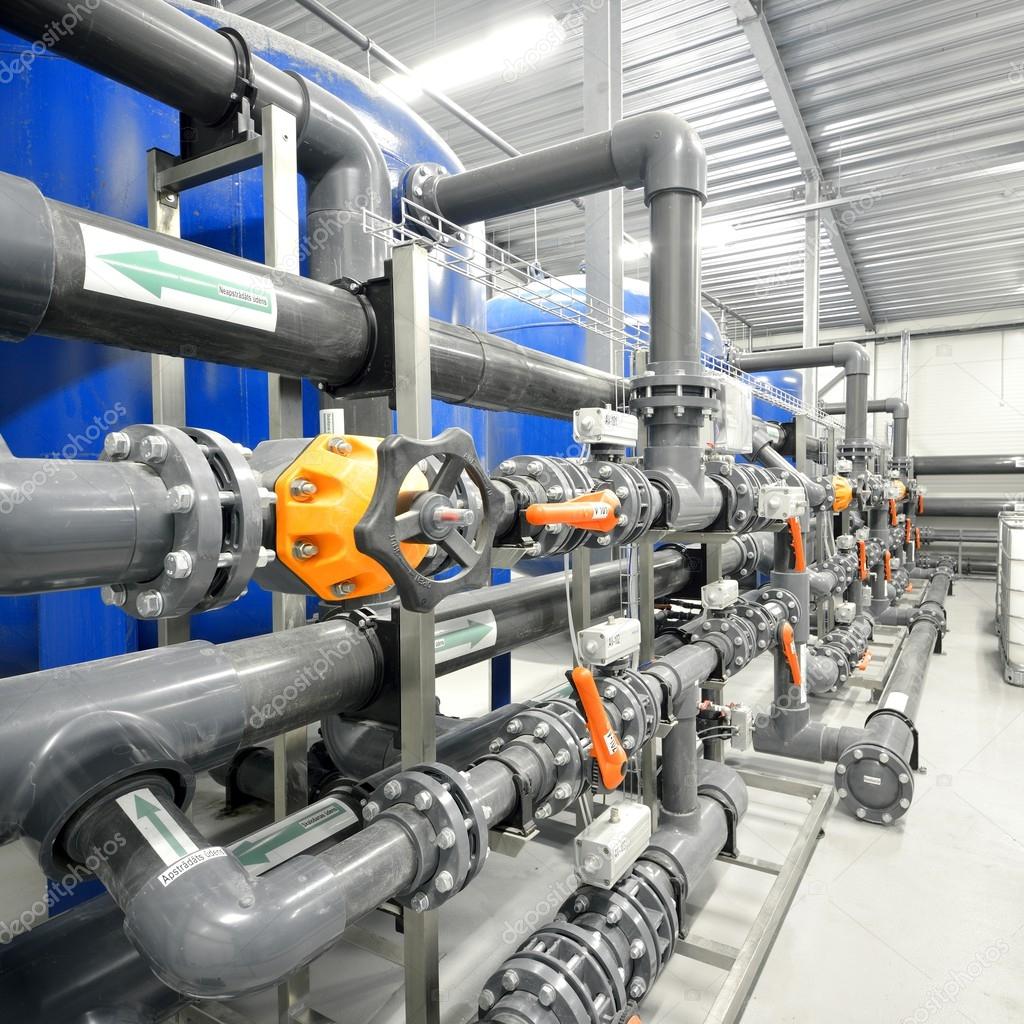 New plastic pipes and colorful equipment in industrial boiler room