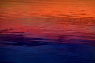 Colorful sunrise on a lake clipart