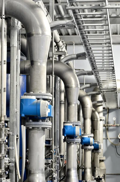 New shiny pipes and colorful equipment in industrial boiler room — Stock Photo, Image