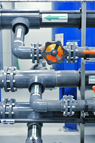 New plastic pipes and colorful equipment in industrial boiler room — Stock Photo, Image