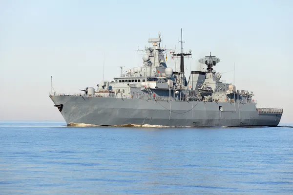 Grey modern warship sailing in still water — Stock Photo, Image