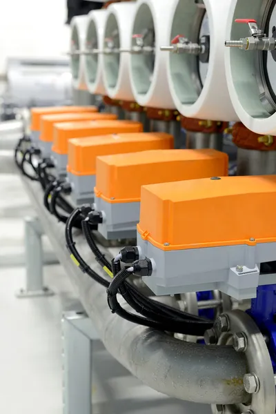 New shiny pipes and colorful equipment in industrial boiler room — Stock Photo, Image