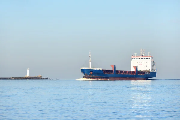 Cargo ship sailing in still water — Stock Photo, Image