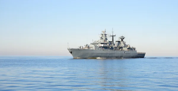 Grey modern warship sailing in still water — Stock Photo, Image