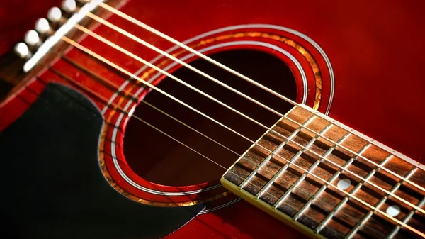Red acoustic guitar close-up — Stock Photo, Image