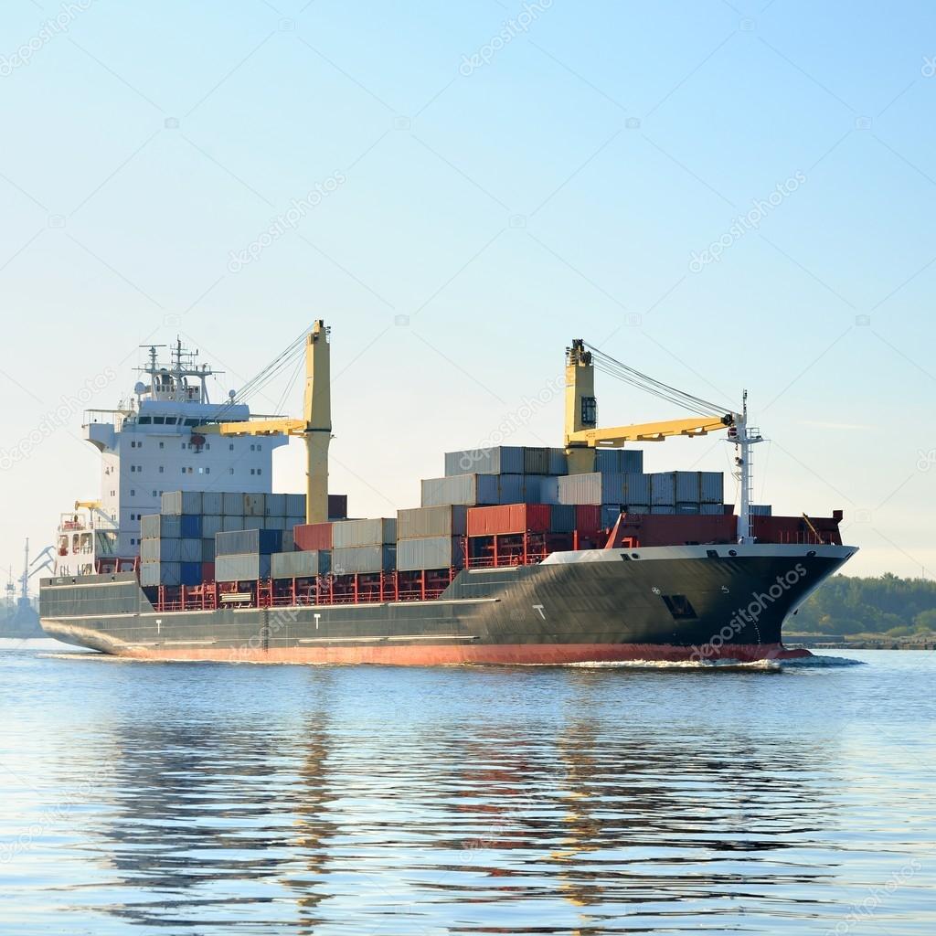 Cargo container ship leaving port of Riga