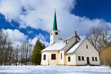 Country side Catholic church in winter clipart