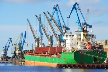 Cargo ship  loading in cargo terminal of Riga clipart