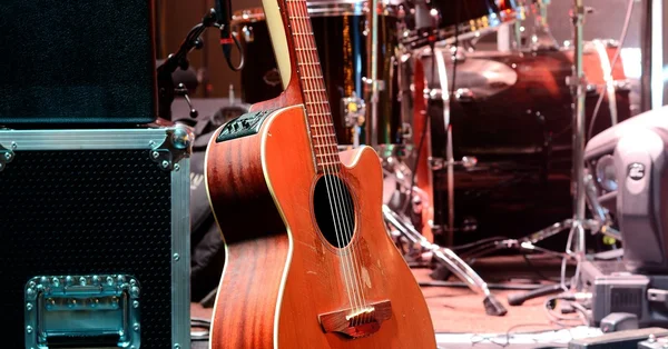 Guitar and other musical equipment on stage — Stock Photo, Image