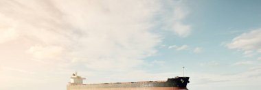 Büyük bir yük gemisi (kargo gemisi) Europoort 'tan açık denizlere açılır. Açık mavi gökyüzü ve sirrus bulutları. Rotterdam, Hollanda. Küresel iletişim, lojistik, endüstri teması