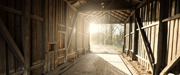 An old abandoned rustic wooden shed, close-up. Agriculture, farm industry, traditional architecture, USA, Wild West, history, gold mine, western, zombie, horror and other graphic resources concepts