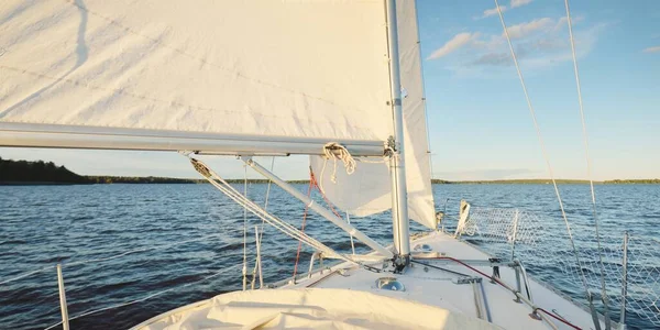 White yacht sailing after the storm. View of the deck, mast, bow. 32 feet swedish built cruising sailboat.