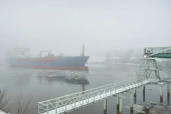 Frozen River Large Cargo Ship Swing Bridge Snow Thick Fog — Zdjęcie stockowe