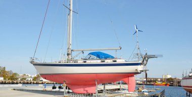 45 ft cruising sailboat standing on land in a yacht marina. Transportation, nautical vessel, repair and service, sailing, sport, recreation. tourism, leisure activity concepts