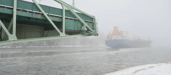 Frozen River Large Cargo Ship Swing Bridge Snow Thick Fog —  Fotos de Stock