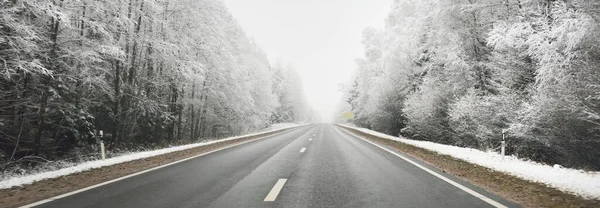 Empty Highway Asphalt Road Snow Covered Forest Rural Area View — 스톡 사진