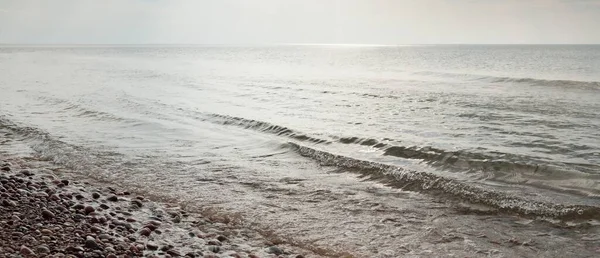 Baltic sea shore after the storm. Water surface, waves. Panoramic image. Nature, environment, ecology concepts