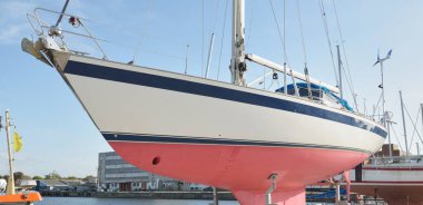 45 ft cruising sailboat standing on land in a yacht marina. Transportation, nautical vessel, repair and service, sailing, sport, recreation. tourism, leisure activity concepts