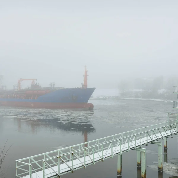 Frozen River Large Cargo Ship Swing Bridge Snow Thick Fog — стоковое фото