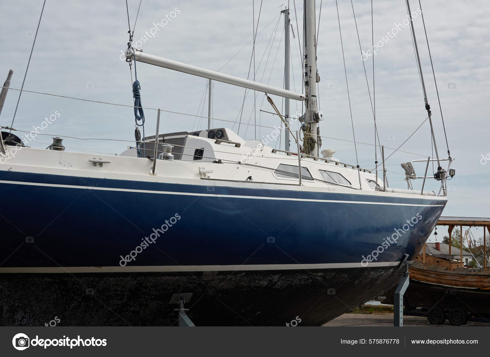 Blue Sloop Rigged Sailboat Standing Land Yacht Club Service Repair