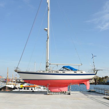45 ft cruising sailboat standing on land in a yacht marina. Transportation, nautical vessel, repair and service, sailing, sport, recreation. tourism, leisure activity concepts