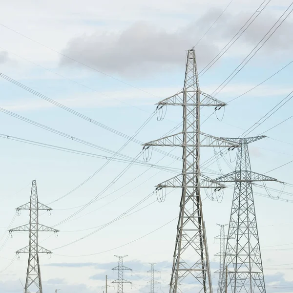 Electricity power line. Dramatic sky. Concept urban landscape. Energy, power generation, equipment, industry, environmental damage, pollution, ecology, supply, infrastructure